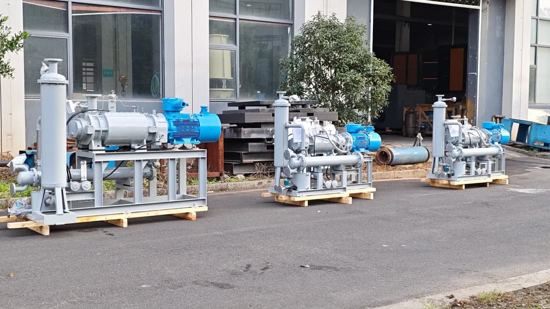 Dry screw vacuum pumps ready for shipment in a factory workshop