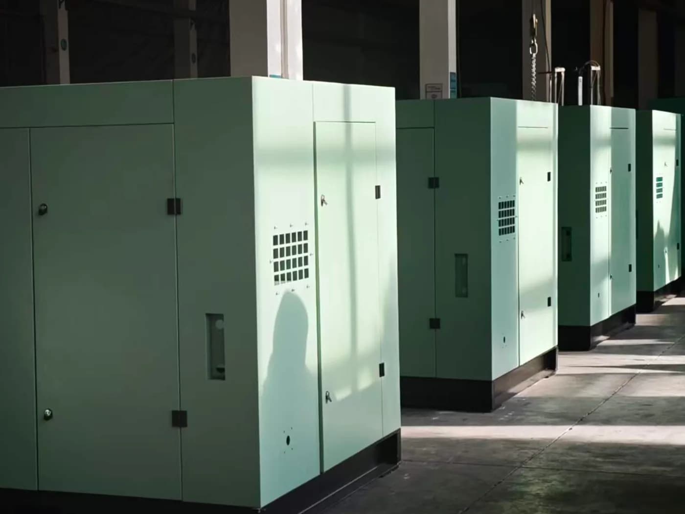 Sheet metal screw vacuum pump system being installed in a factory workshop