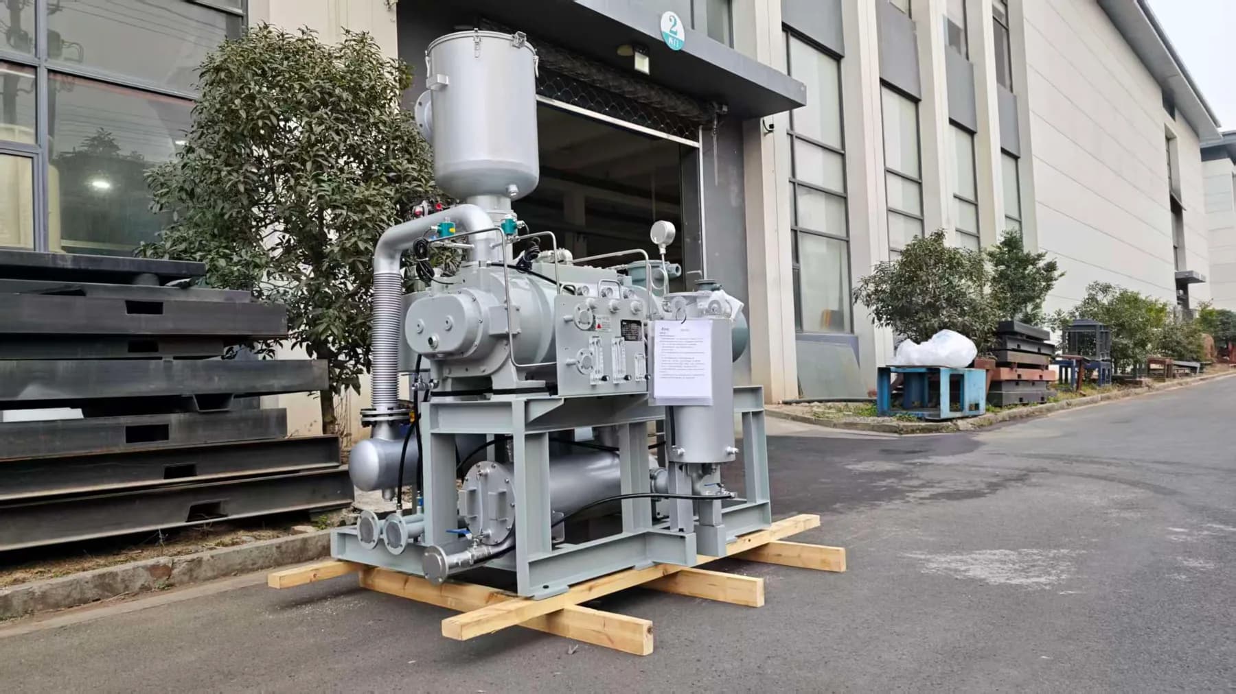 Dry screw vacuum pump system staged outside the factory before shipment