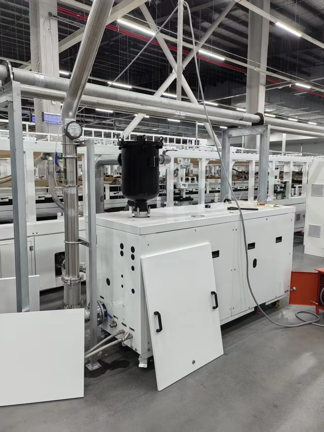 Customer-site vacuum system with inlet-side process piping for a wet carryover application