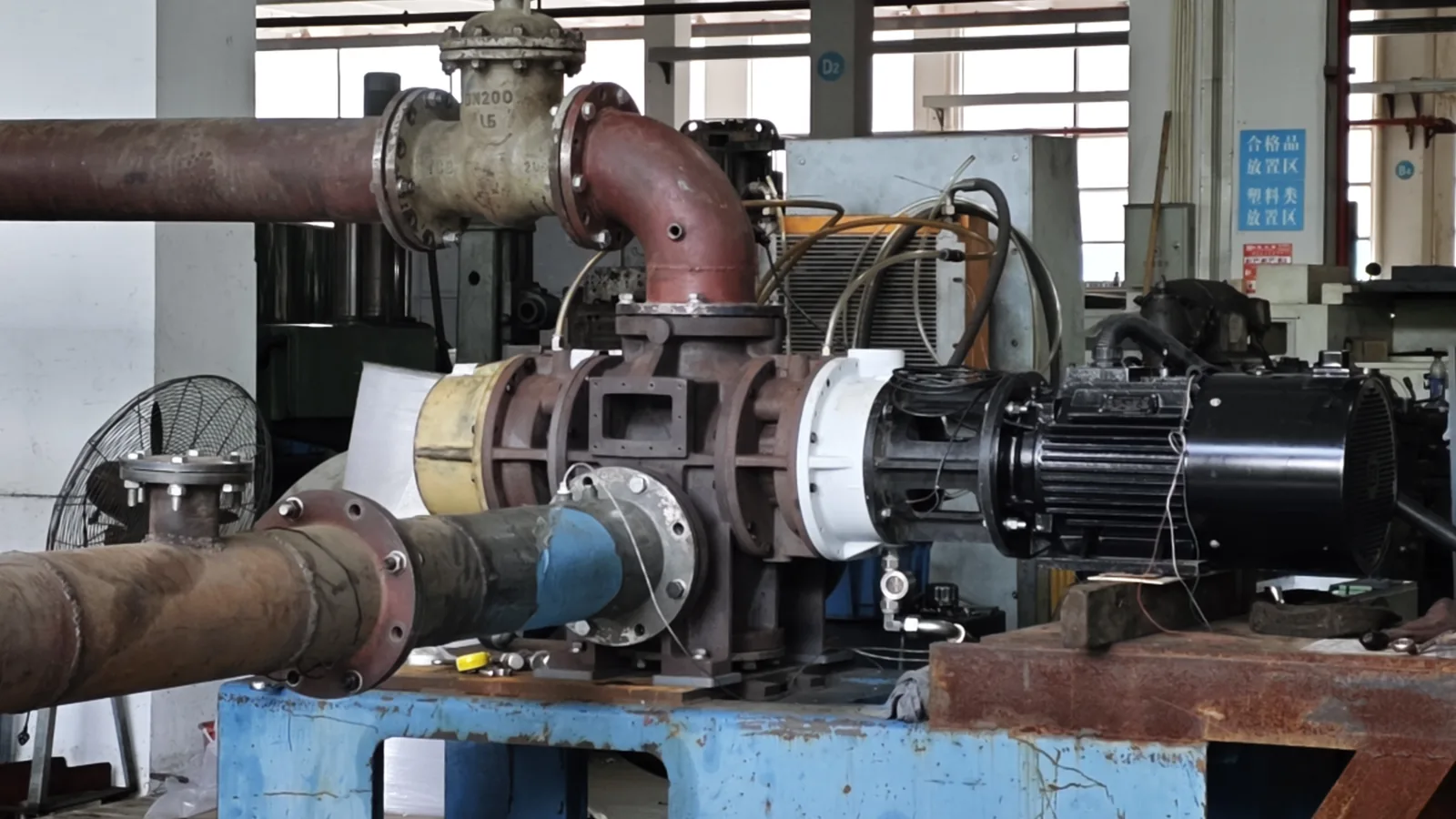TF140 dry screw vacuum pump in-house performance test setup with process piping for verified operating-point review of working pressure and volumetric flow rate before dry screw vacuum pump RFQ selection